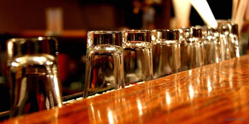 Shot glasses on a bar photographed by CDOM